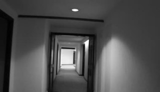 depositphotos_70900917-Walking-down-a-hotel-corridor